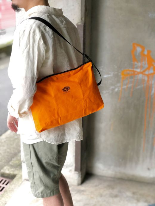 NECESSARY or UNNECESSARY 90020740 / NOUN POST 'VINYLON' / ORANGE