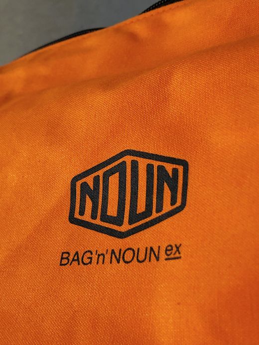 NECESSARY or UNNECESSARY 90020740 / NOUN POST 'VINYLON' / ORANGE