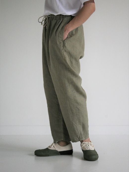 ANACHRONORM OVER DYE TAPERED EASY PANTS / Light olive