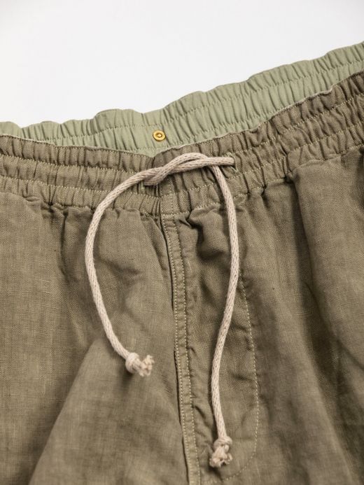ANACHRONORM OVER DYE TAPERED EASY PANTS / Light olive